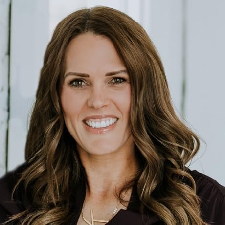 Scoop of Power Shot Greens Superfood powder next to glass of green drink